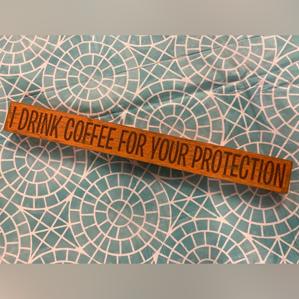 “I Drink Coffee for your Protection” wooden comedic decorative sign.